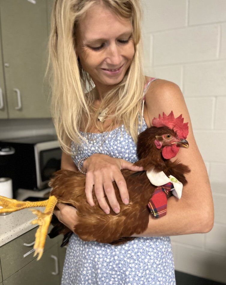 Kelly Rutkowski holding Christopher Clucken at last class.jpg